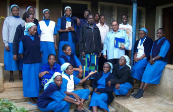 A group of African Sisters wearing blue religious clothing