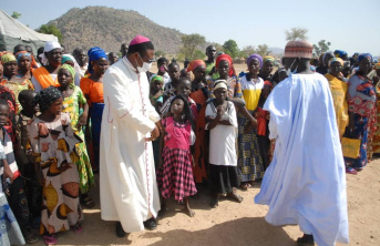 Bishop Oliver Doeme Dashe with Christian families in Nigeria
