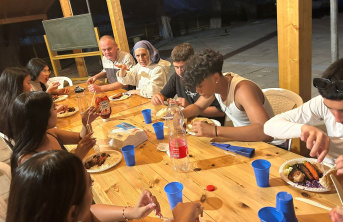 Children around a table enjoying a meal