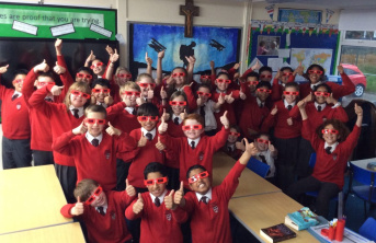 Primary School Students supporting ACN Red Wednesday with red sunglasses
