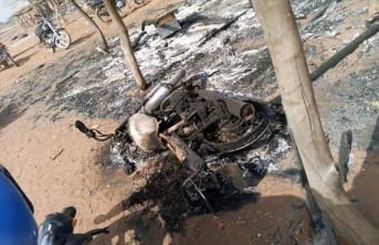Torched motorcycle during Nigeria attacks
