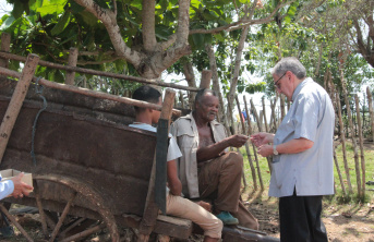 Bishop Arturo Gonzalez of Santa Clara, talking with some people in the countryside 