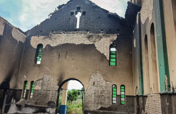 A damaged church hall including extensive burn marks and missing chapel roof