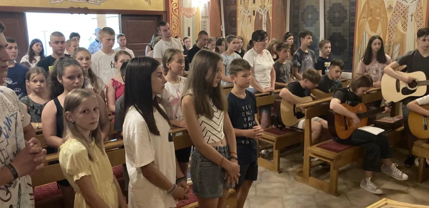 Summer camp youngsters take part in a church service in Mukachevo diocese, Ukraine.