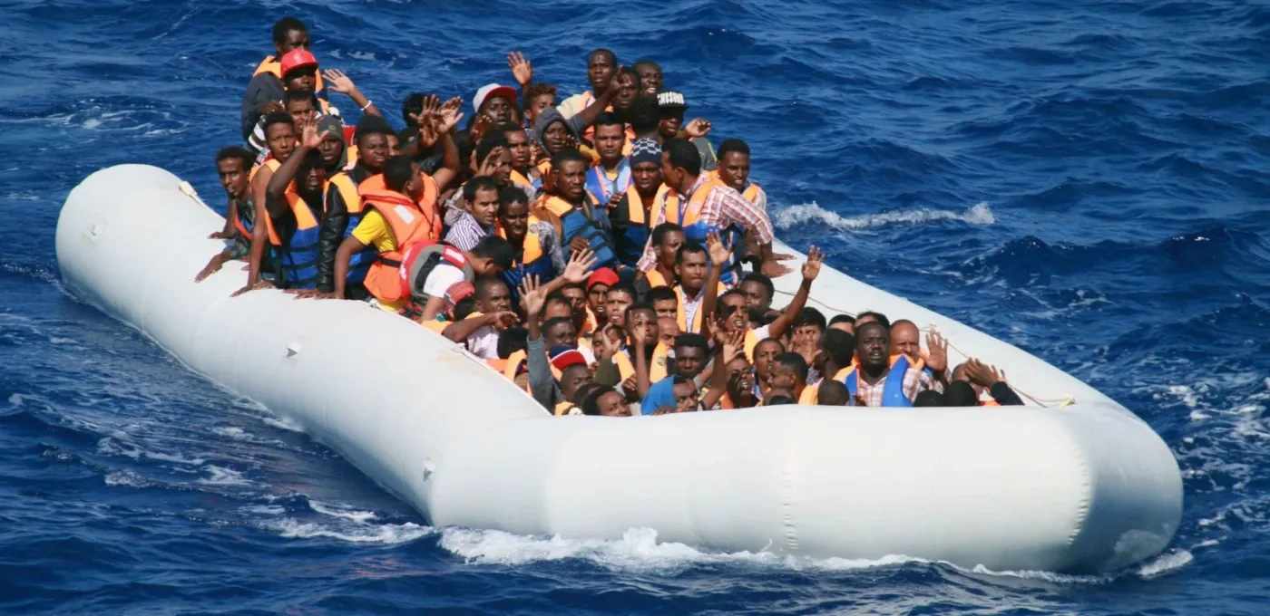 Illegal migrants aboard an inflatable dinghy