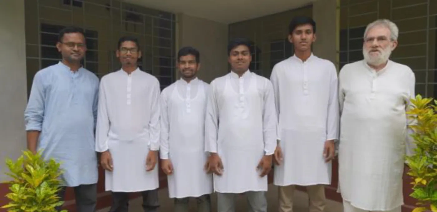 A Jesuit priest with novices in Bangladesh.