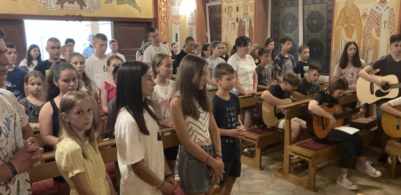 Summer camp youngsters at a Church service in Ukraine.