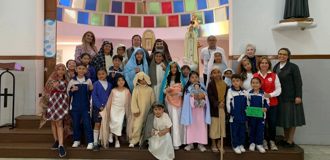 Children praying the Rosary in Bogotá, Colombia.