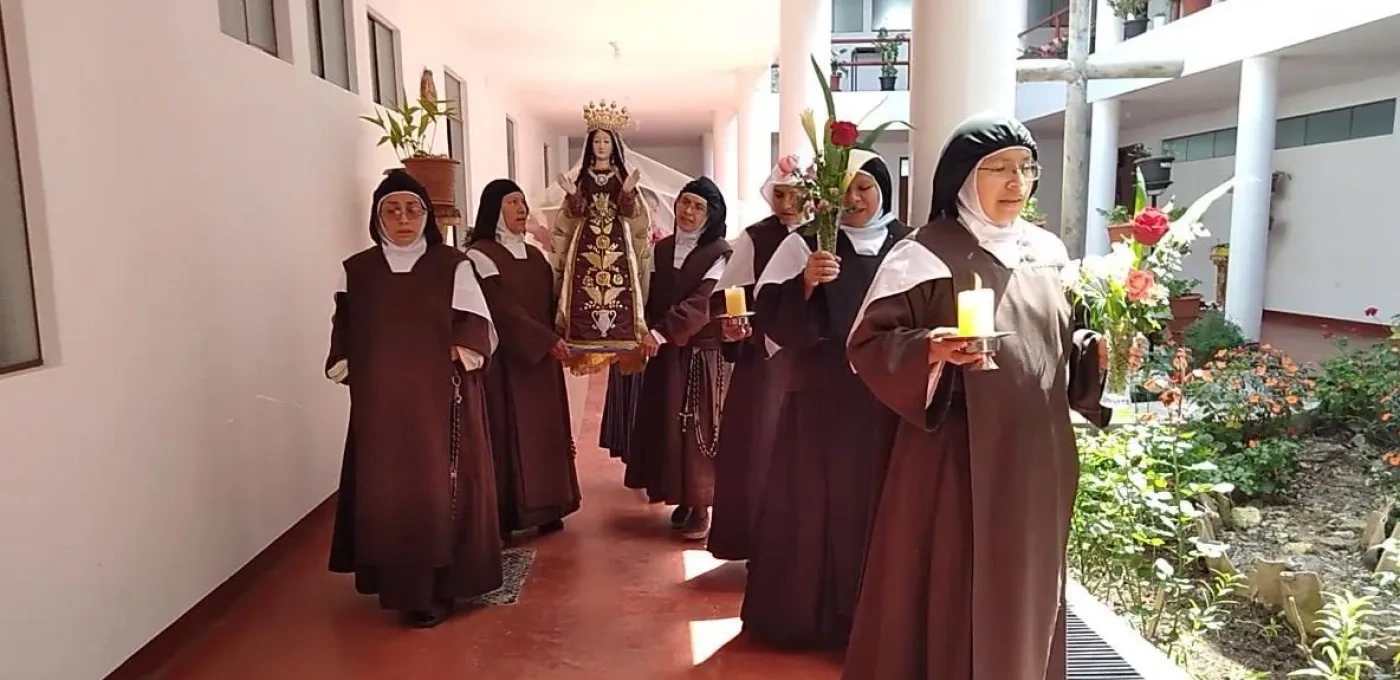 Nun's walking down a halway