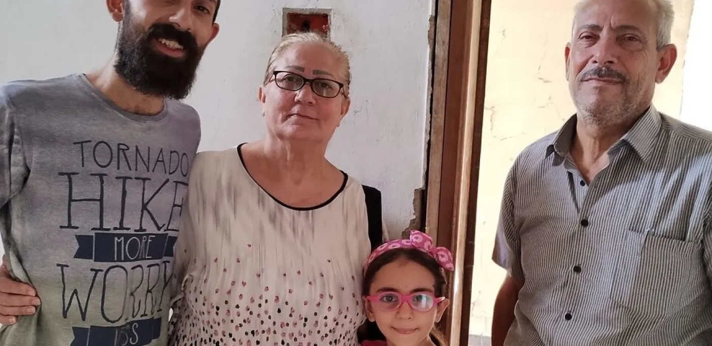 A Christian Syrian family whose home was destroyed.