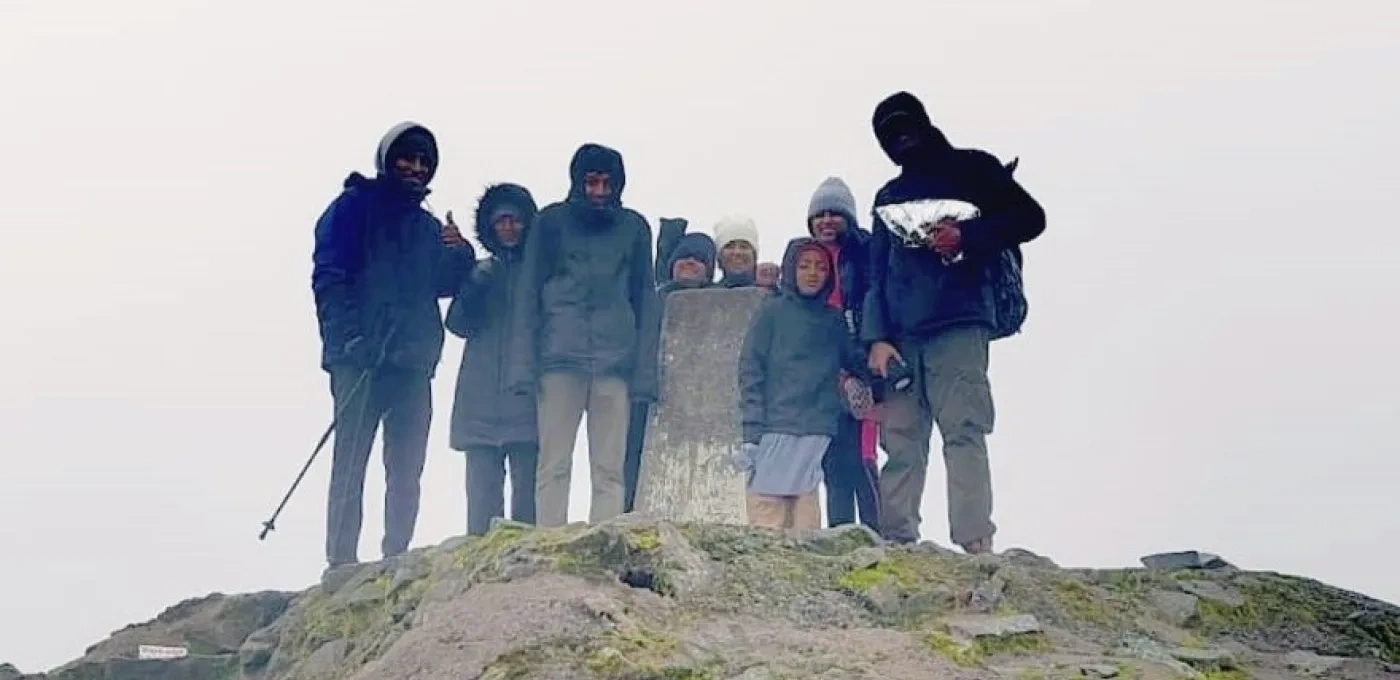The Do Rozario and Pampackal families on top of Ben Nevis. (© Aloma Pampackal)