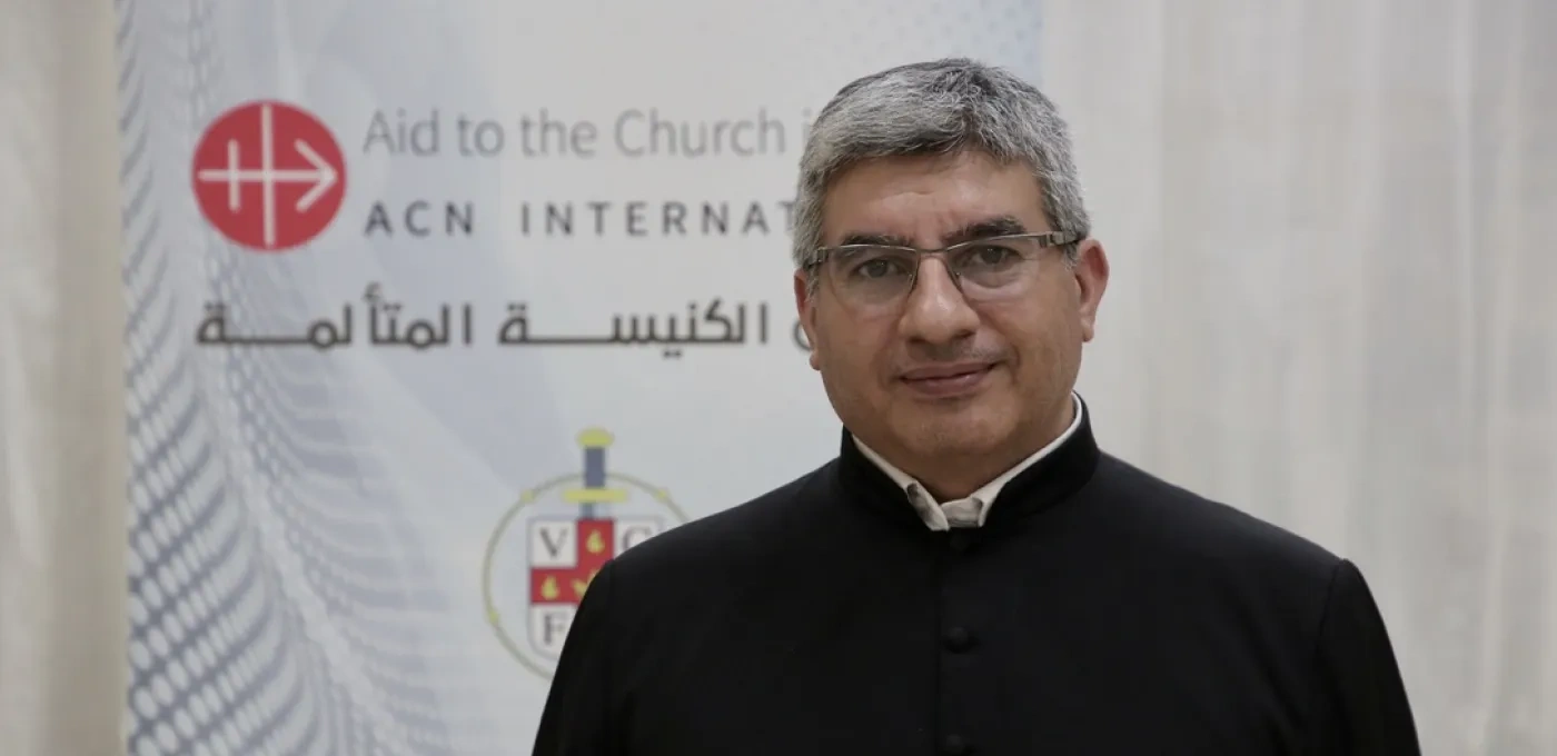 Priest visiting ACN International headquarters