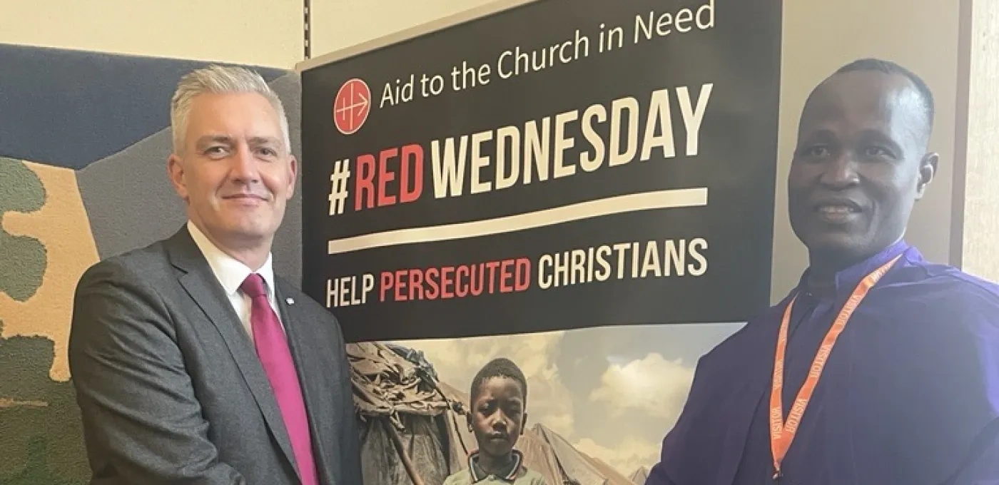 Tobias Yahaya shaking the UK Government FoRB Envoy David Smith MP