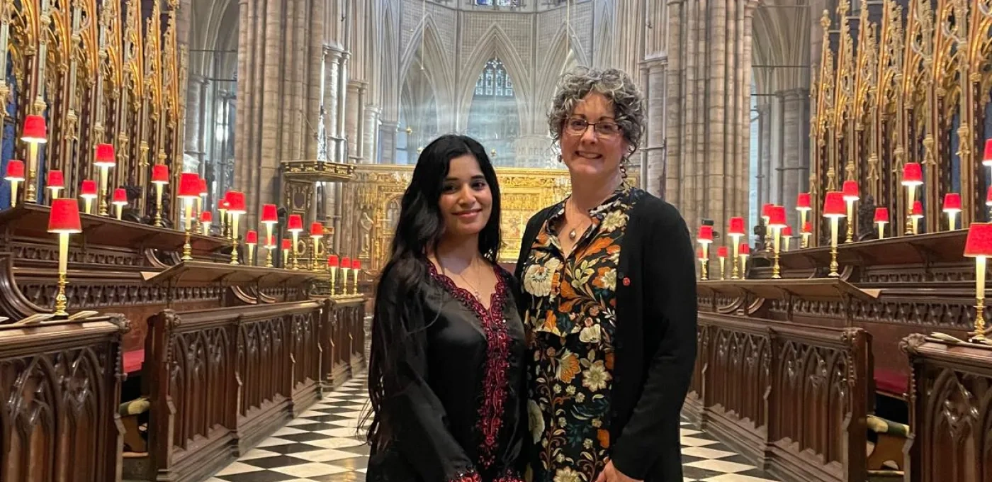 Ribqa Nevash and Caroline Hull standing in Westminster Abbey