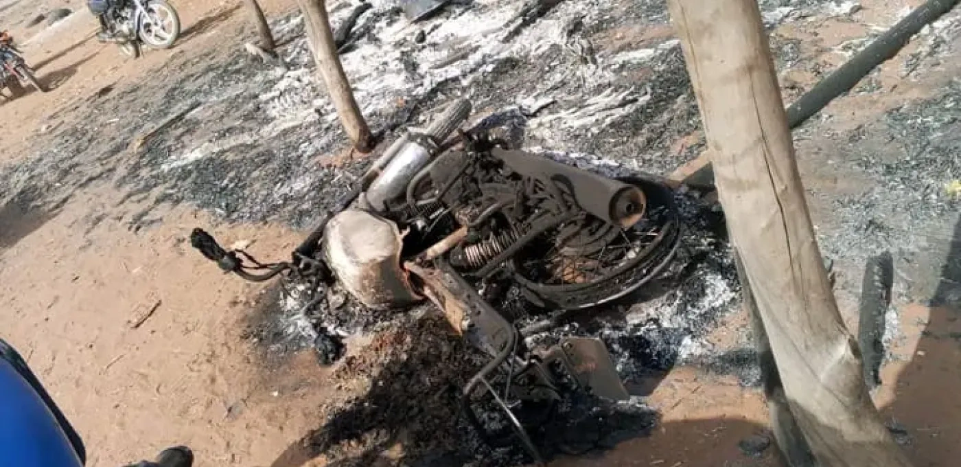 Torched motorcycle during Nigeria attacks