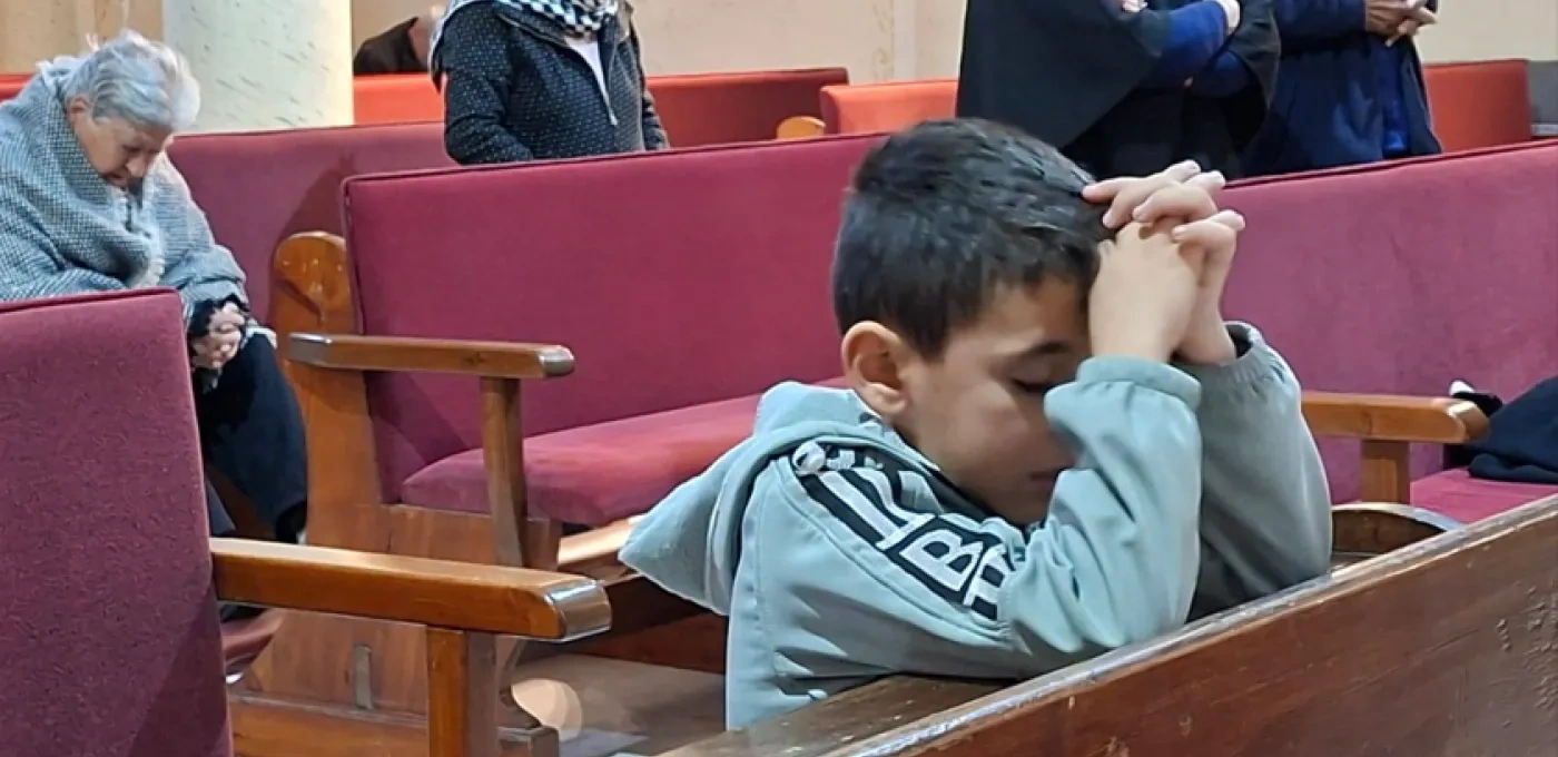 Young boy praying in Gaza
