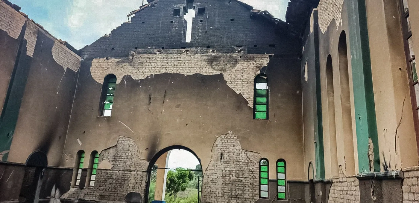 A damaged church hall including extensive burn marks and missing chapel roof