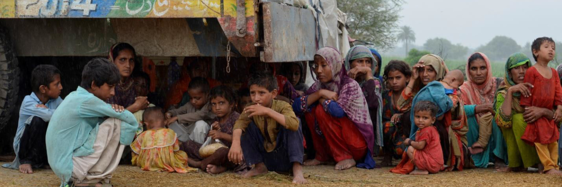 Women and children in Pakistan huddled together