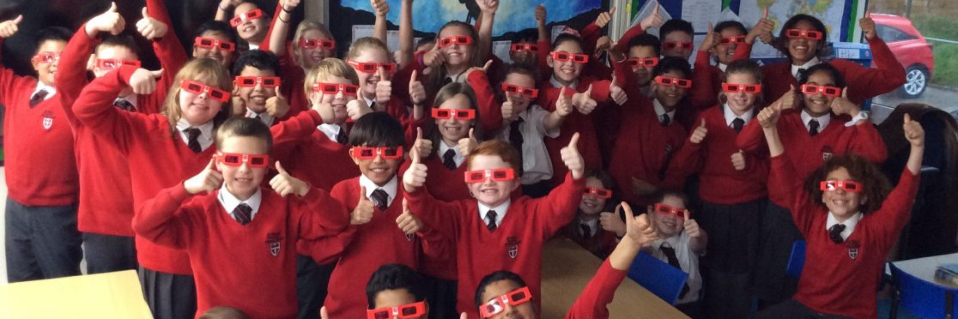 Primary School Students supporting ACN Red Wednesday with red sunglasses