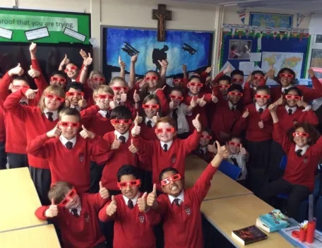 Primary school children celebrating #RedWednesday