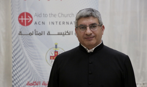 Priest visiting ACN International headquarters