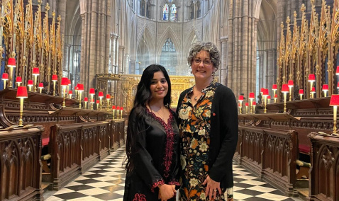 Ribqa Nevash and Caroline Hull standing in Westminster Abbey