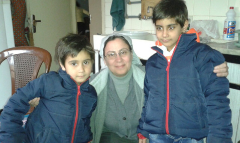  Syria-based Sister Annie Demerjian with displaced children