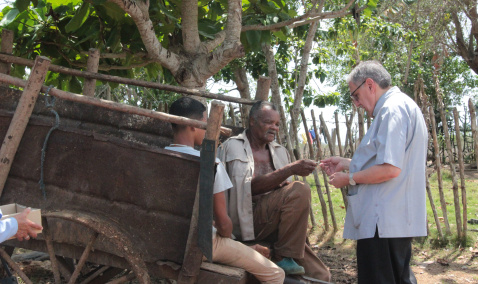 Bishop Arturo Gonzalez of Santa Clara, talking with some people in the countryside 