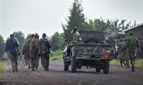 M23 fighters loyal to Rwanda move along the road towards Goma