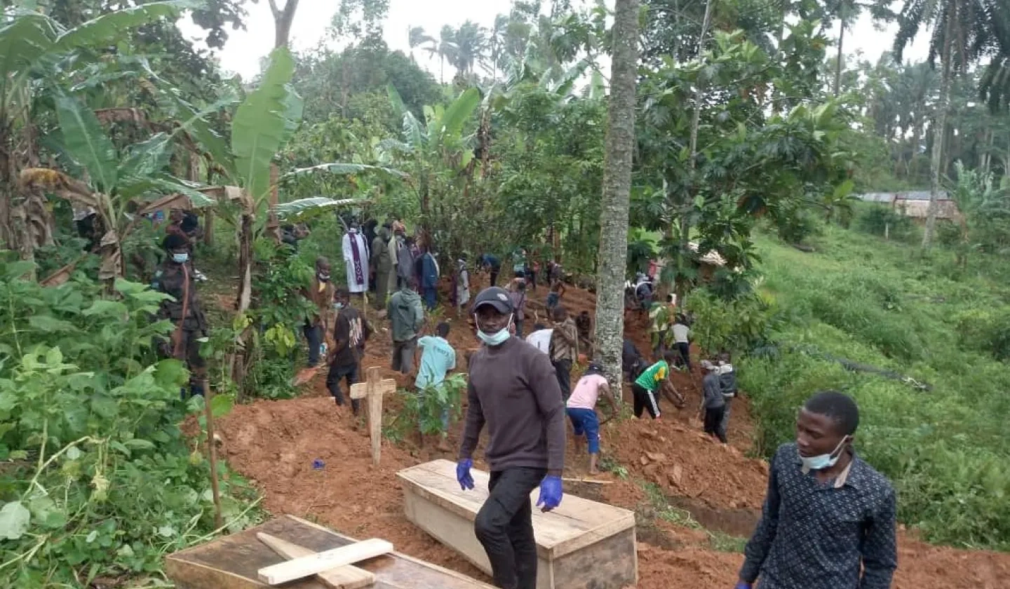 People burying victims in a forest area after ADF massacres in the DRC.