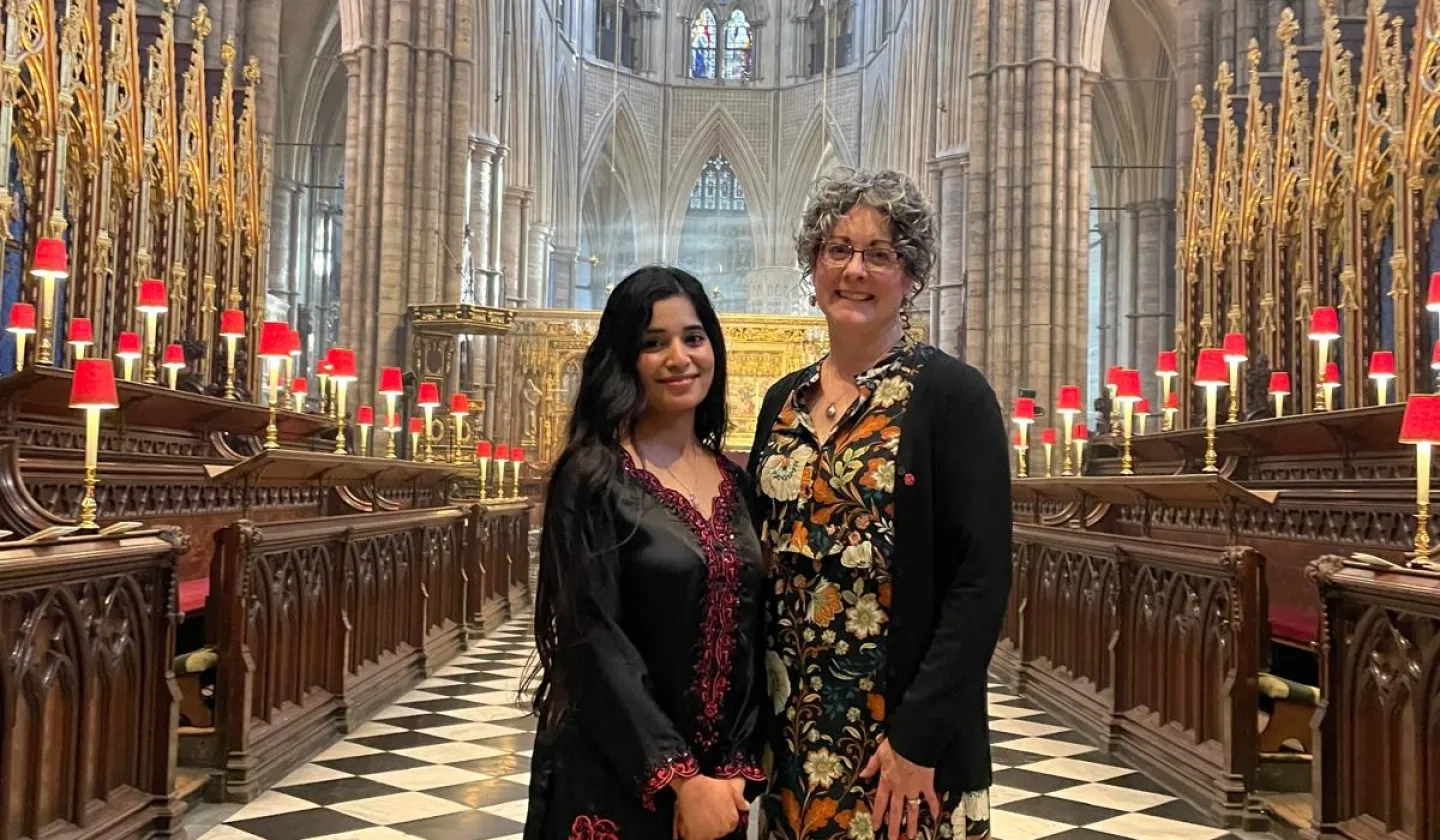 Ribqa Nevash and Caroline Hull standing in Westminster Abbey