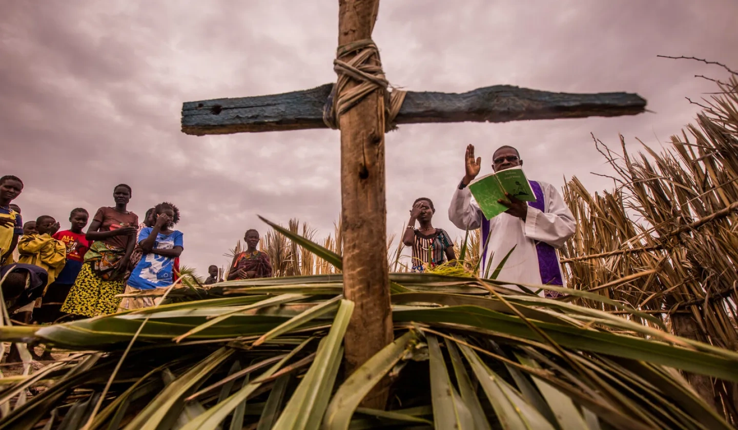 With file picture of priest conducting a burial in Ñamukuse, near to Lake Turkana, Kenya (Image © Ismael Martínez Sánchez / ACN).