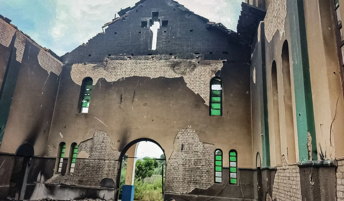 A damaged church hall including extensive burn marks and missing chapel roof