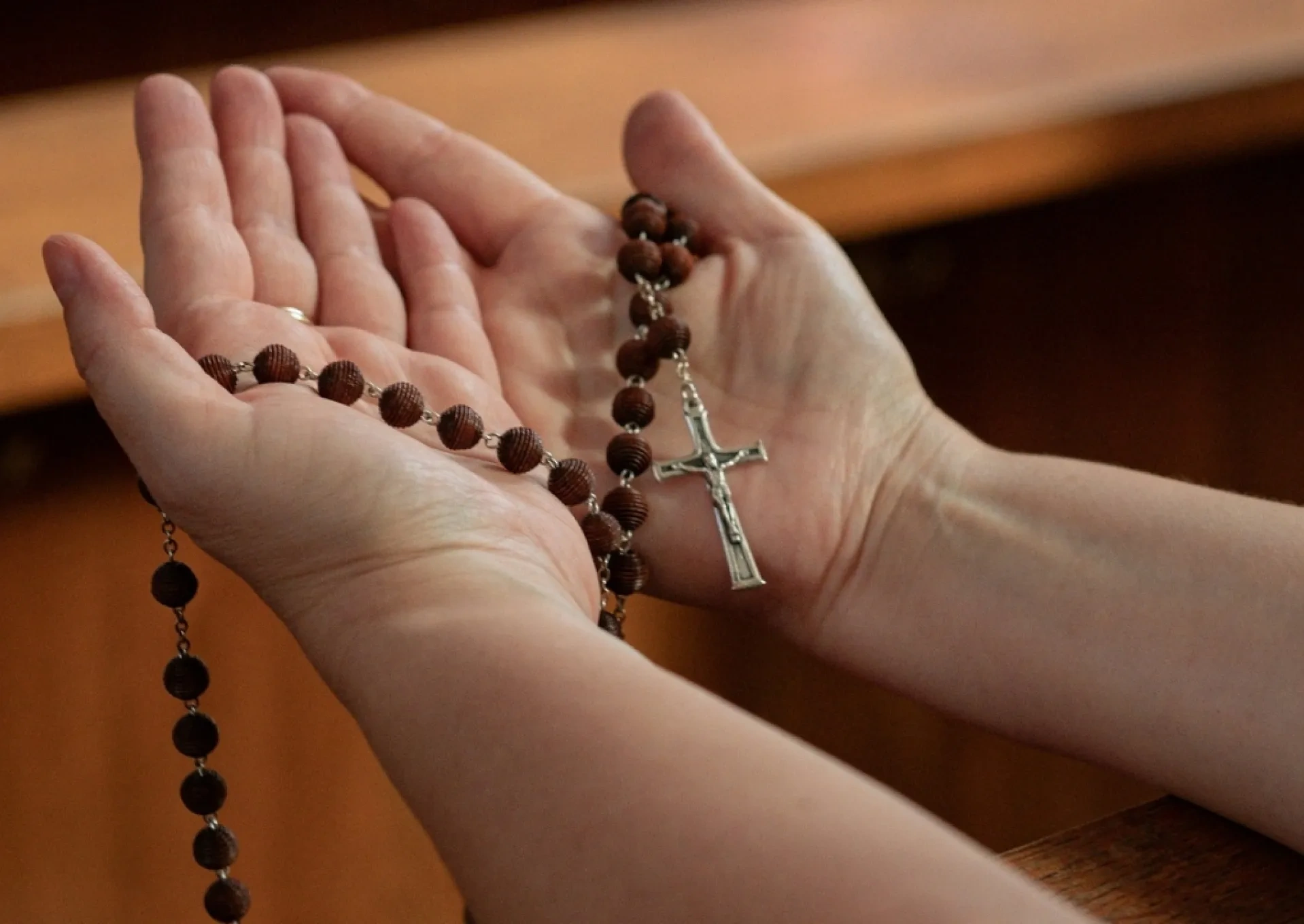 Rosary in a woman's hand