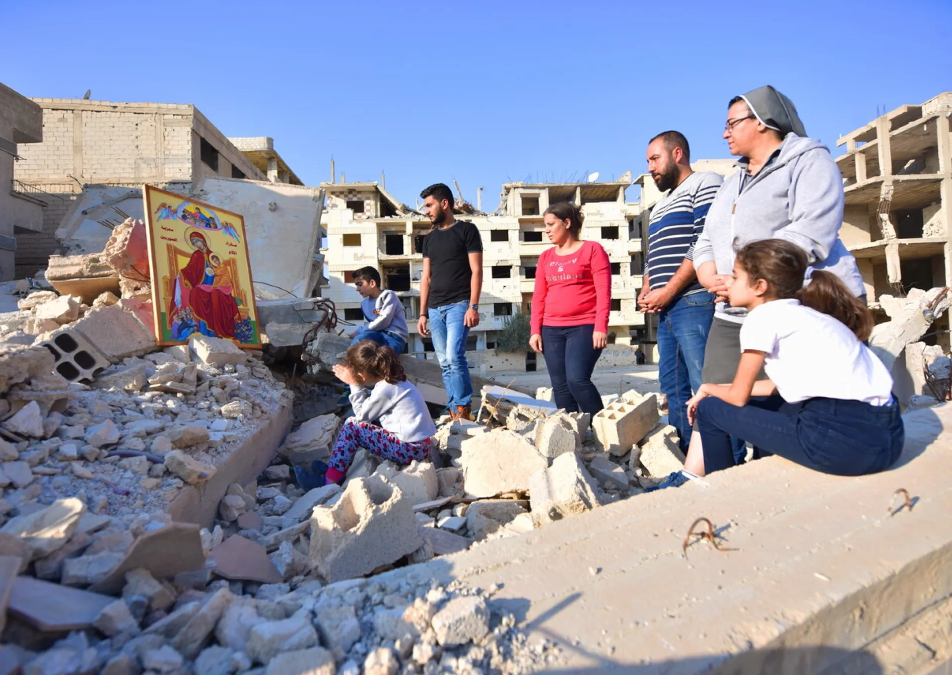 People praying despite destruction of Eastern Ghouta, Syria.