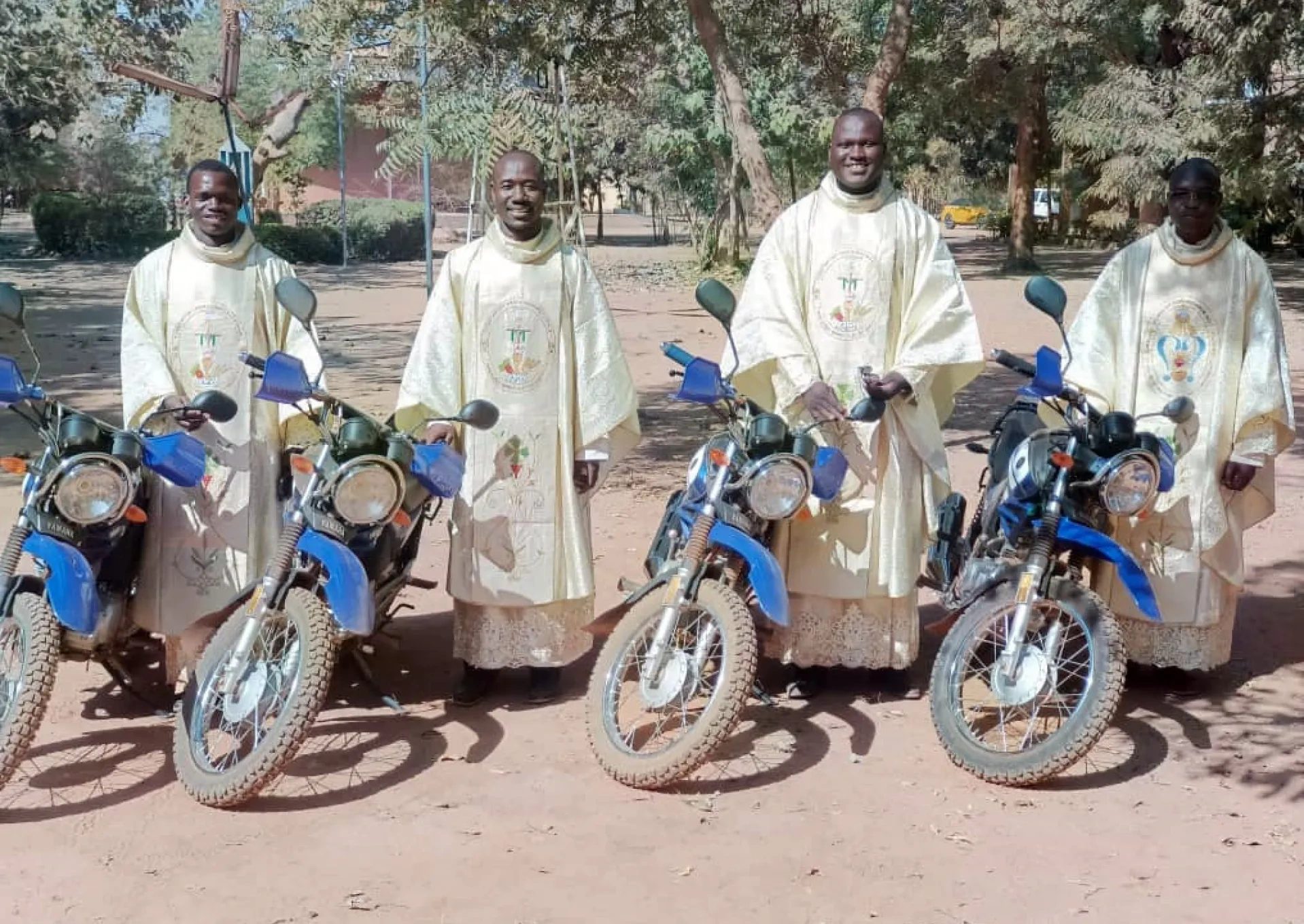 4 priests with their new motorcycles