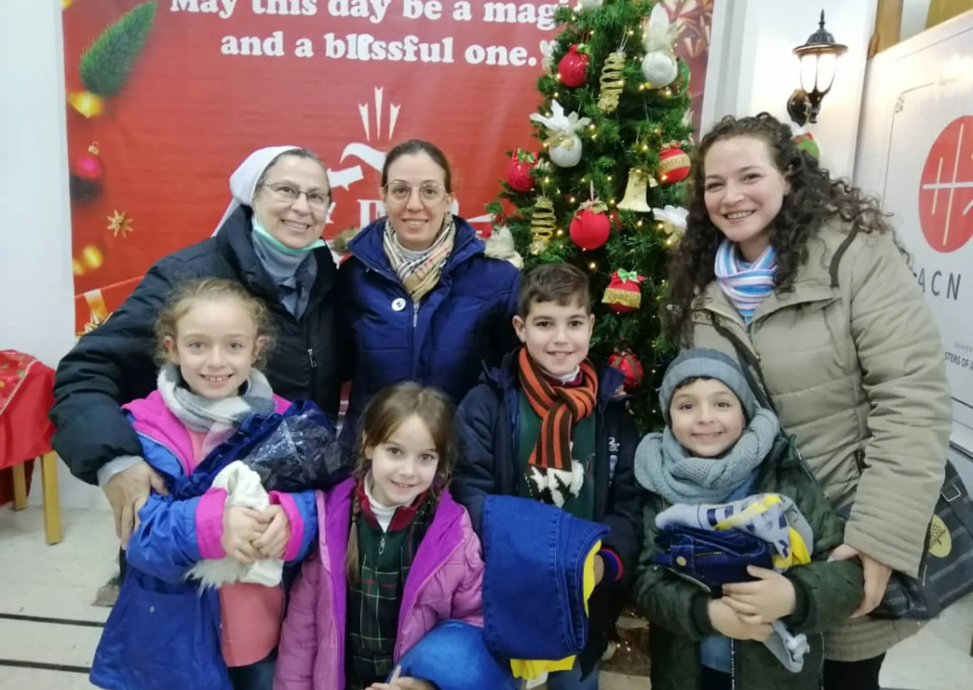 Sister and family receiving Christmas gifts.
