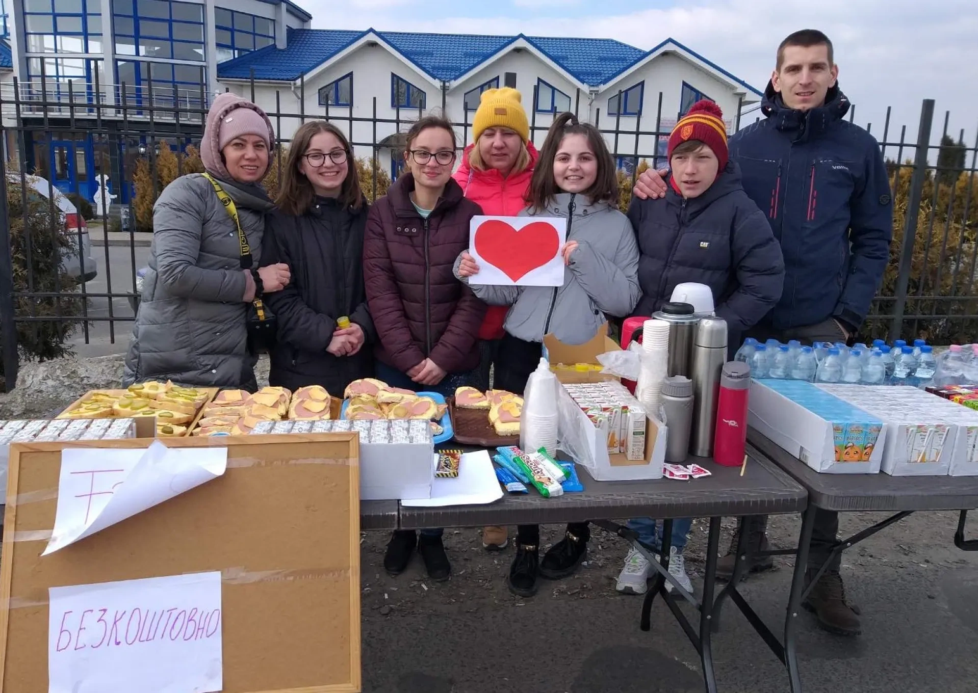 People giving out aid and supplies in Ukraine