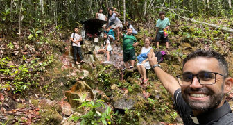 A priest visiting a remote community in the Amazon