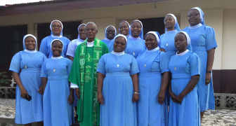 Group photo of the sisters with their formator during retreat, Liberia