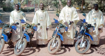 4 priests with their new motorcycles
