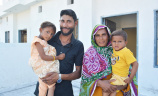 A Pakistan Christian family in their new home