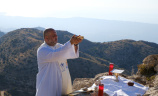 A priest offering a Mass outside in the Lebanon mountains