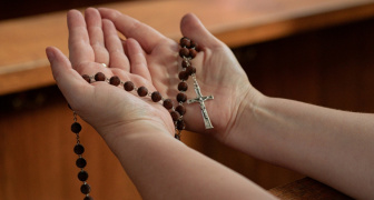 Rosary in a woman's hand