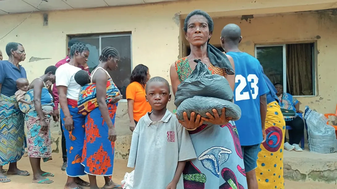 Displaced woman and child collecting food