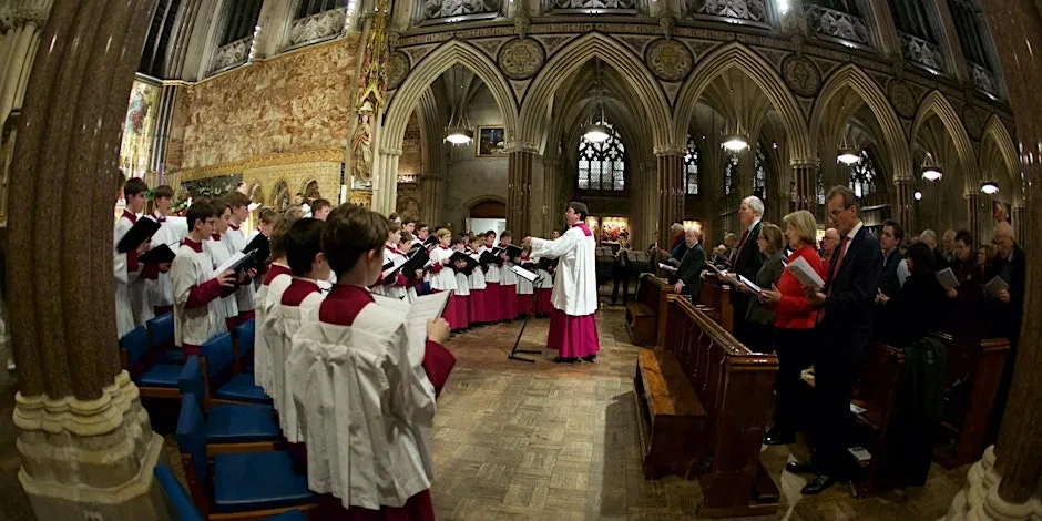 Priest and Choir boys performing at Christmas Carol Service