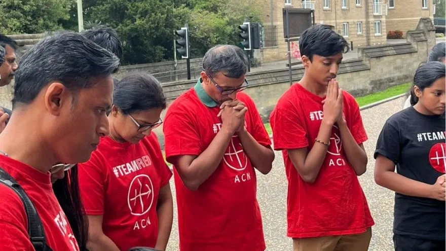 Family saying their prayers for ACN #RedWednesday