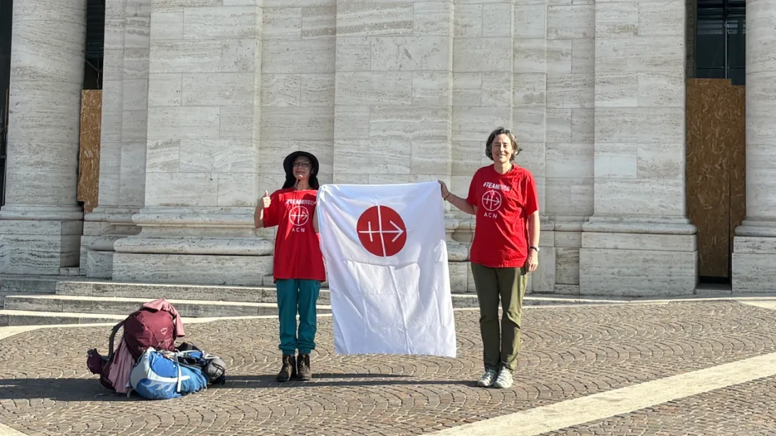 ACN fundraisers holding a banner