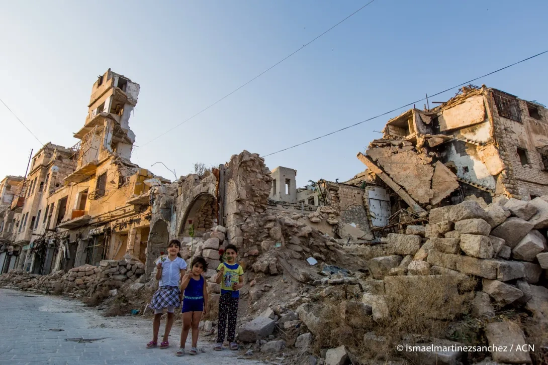 Children standing by a destroyed Church