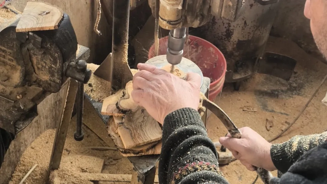 Someone carving olive wood products in Bethlehem